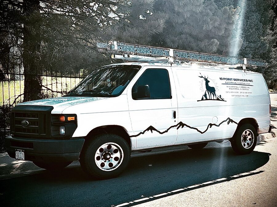 The 10 Point Services van with the elk and mountain logo on the side panel.
